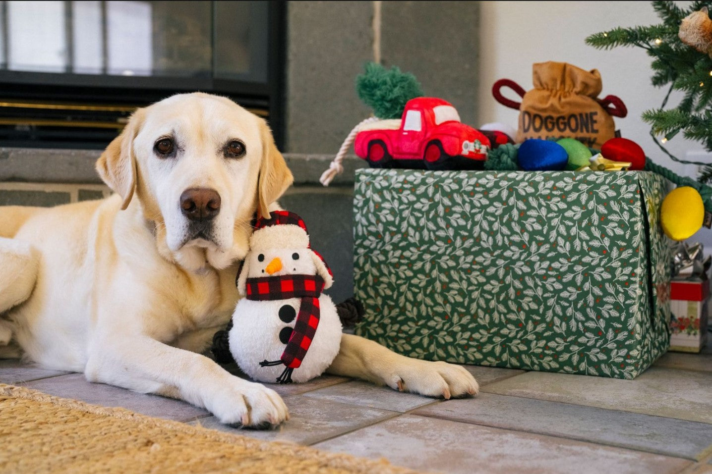 Yellow Lab with a holiday dog toy collection called Home for the Holidays.