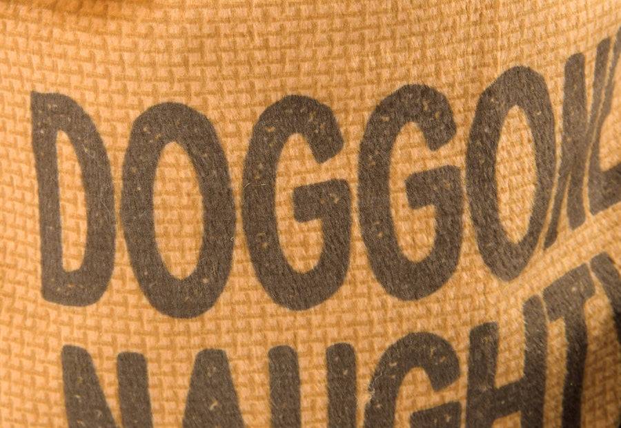 P.L.A.Y. Home for the Holidays Fur-Ever Naughty Toy - close up of text Doggone Naughty