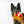 Load image into Gallery viewer, IHOP x P.L.A.Y. Thick &#39;N Fluffy French Toast  - fluffy brown dog holding the toy in its mouth staring into camera with ears perked up
